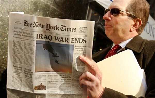 Man holds fake New York Times
